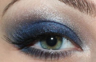 Sparkly white eye shadow Mattify cosmetics navy blue eye makeup look alternative to black smoky eyeshadow looks for holiday parties eye makeup with built in primer to absorb oil and stay crease-free all day wear false lashes best eye shadow colors for green eyes